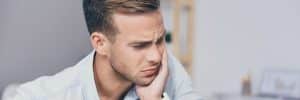 Young man with dental pain.